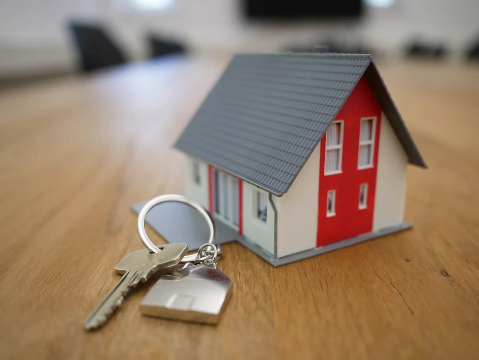 House model and keys representing a property transaction